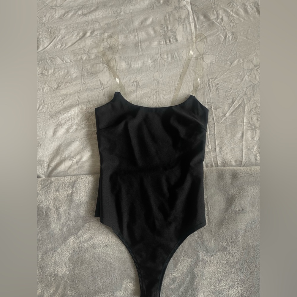 Never worn! Black, clear adjustable straps, spandex material, bodysuit